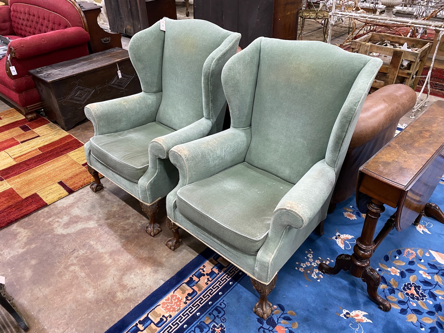 A pair of George III style wing armchairs, width 78cm, depth 66cm, height 99cm